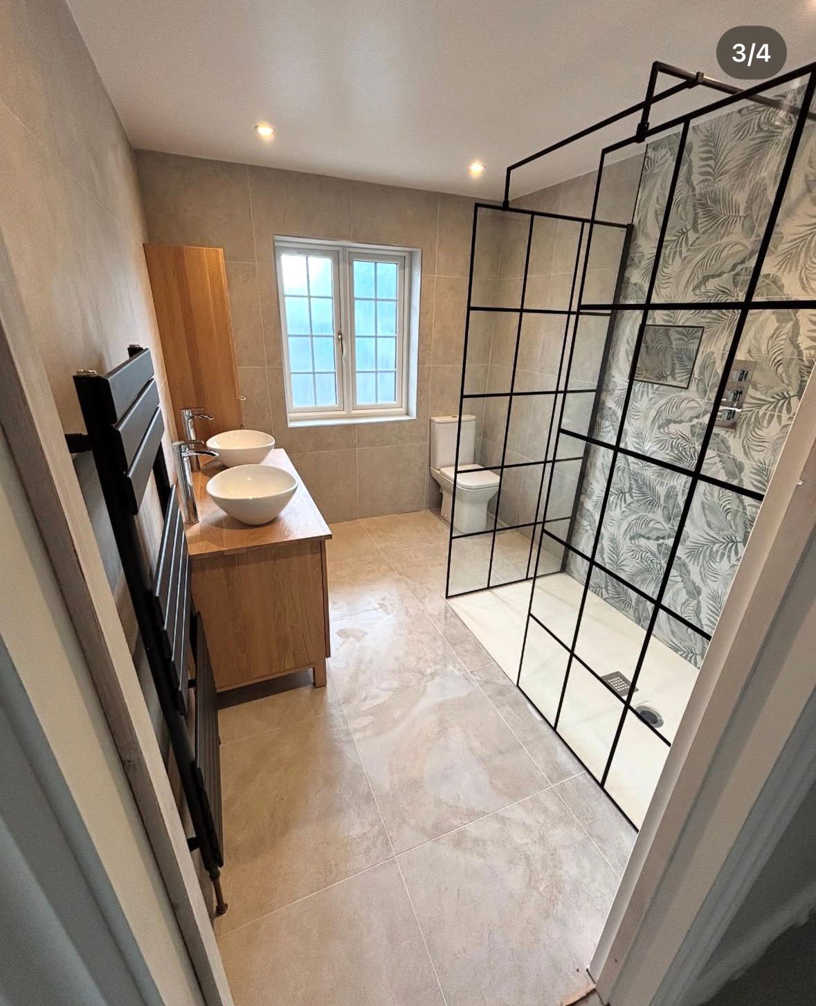 Bathroom installation with walk-in shower and twin basins